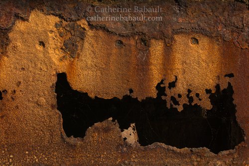 close-up of a hole on a rusty ship, Vancouver Island, British Columbia, Canada, rights-managed, stock images, © Catherine Babault